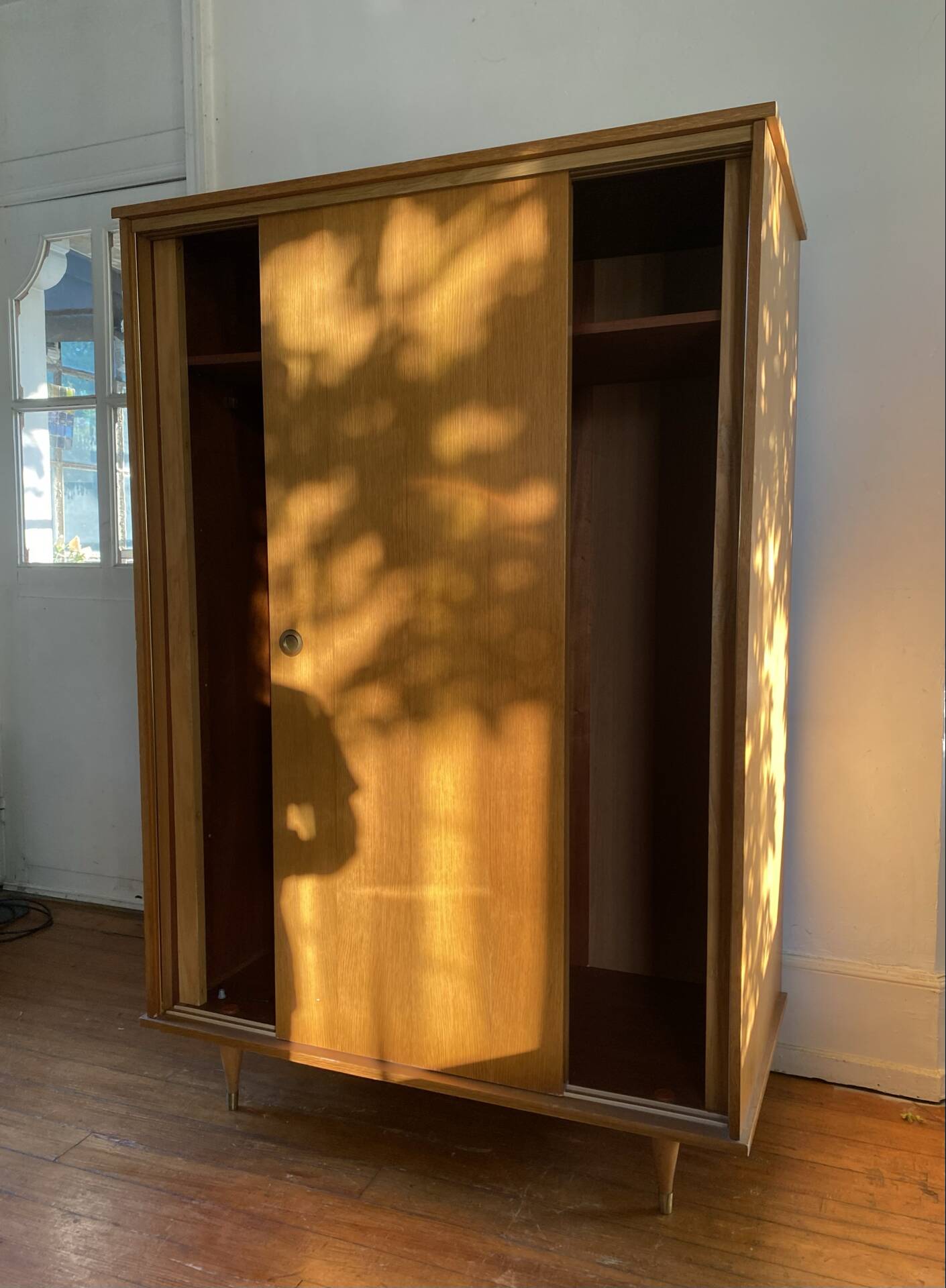 Large vintage Scandinavian wardrobe with two sliding doors.