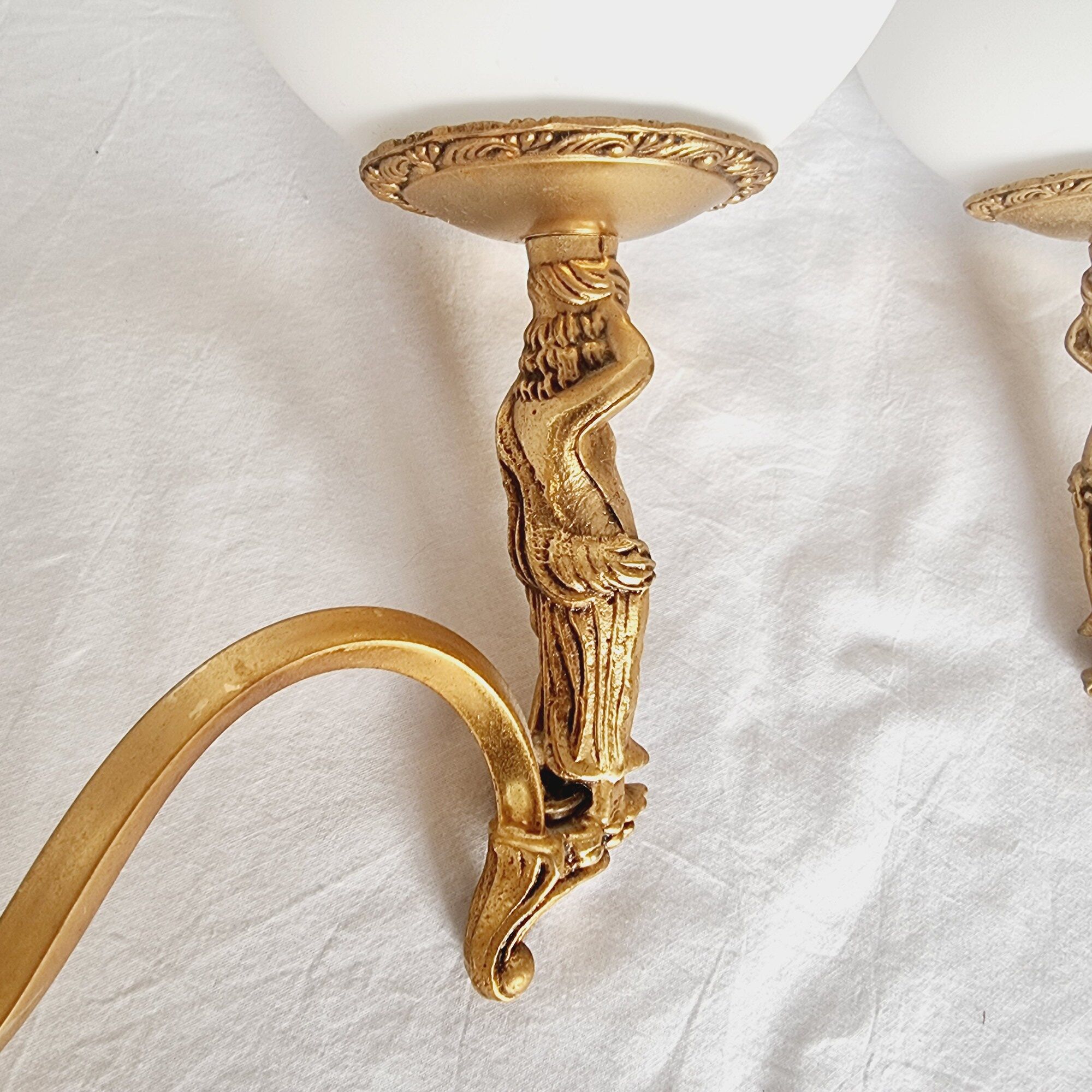 2 classic golden cherub wall lights and globe lampshades in perfect condition.