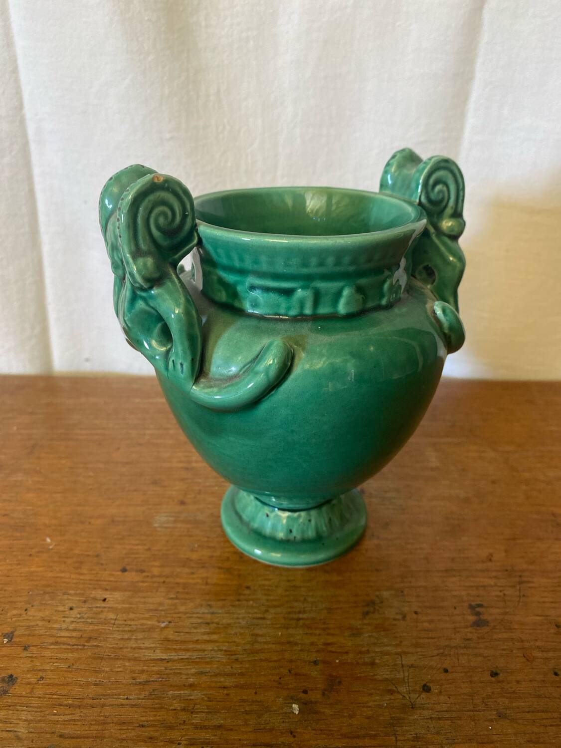 Antique green ceramic vase with handles