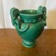 Antique green ceramic vase with handles