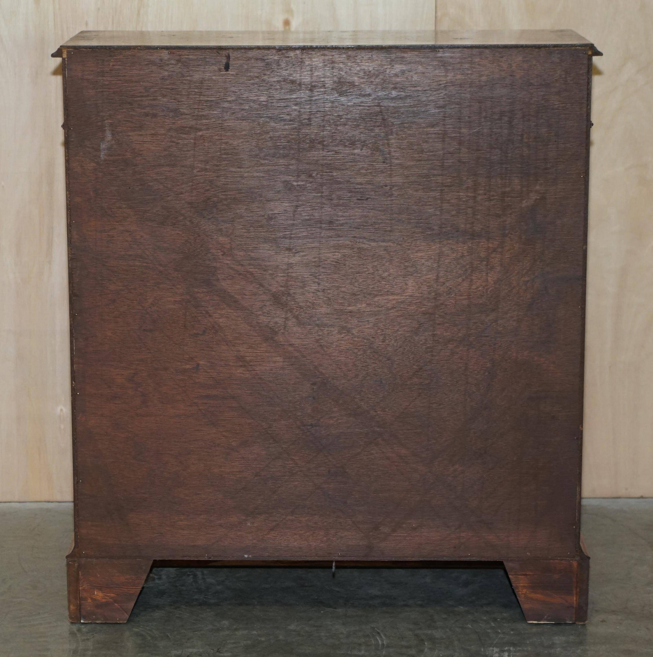 Brights of Nettlebed style Sheraton dwarf library in burr elm, walnut, and mahogany.
