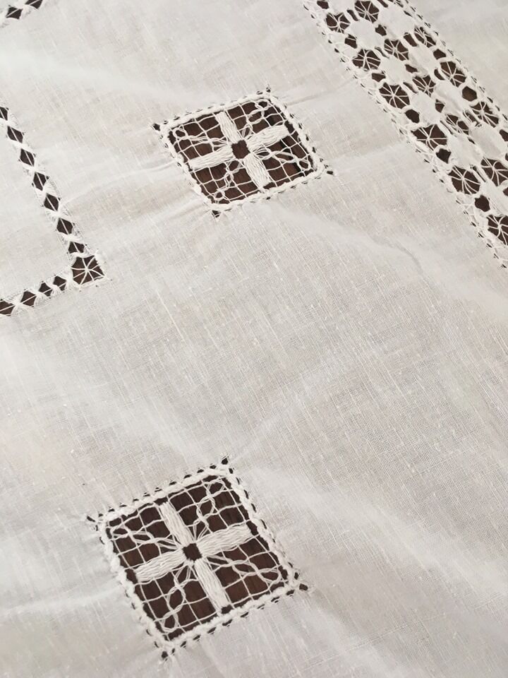 Net-style embroidered cotton tablecloth.