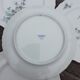 Lot of 4 flat plates, blue flowers model Gabrielle Porcelaine Limoges Bernardaud e
