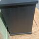 Vintage commode revamped in matte black & wood with warm tones.