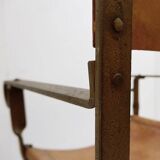Curule armchair in wrought iron and leather