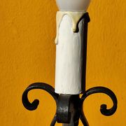 Old metal lamp and fake candle