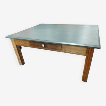 Oak coffee table with gray top.