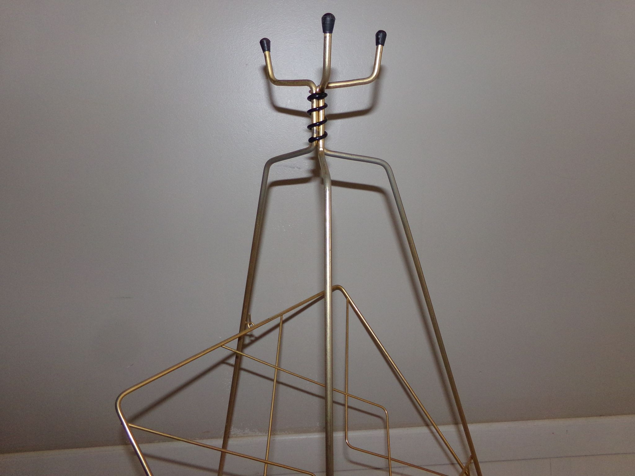 Vintage magazine holder in gold metal