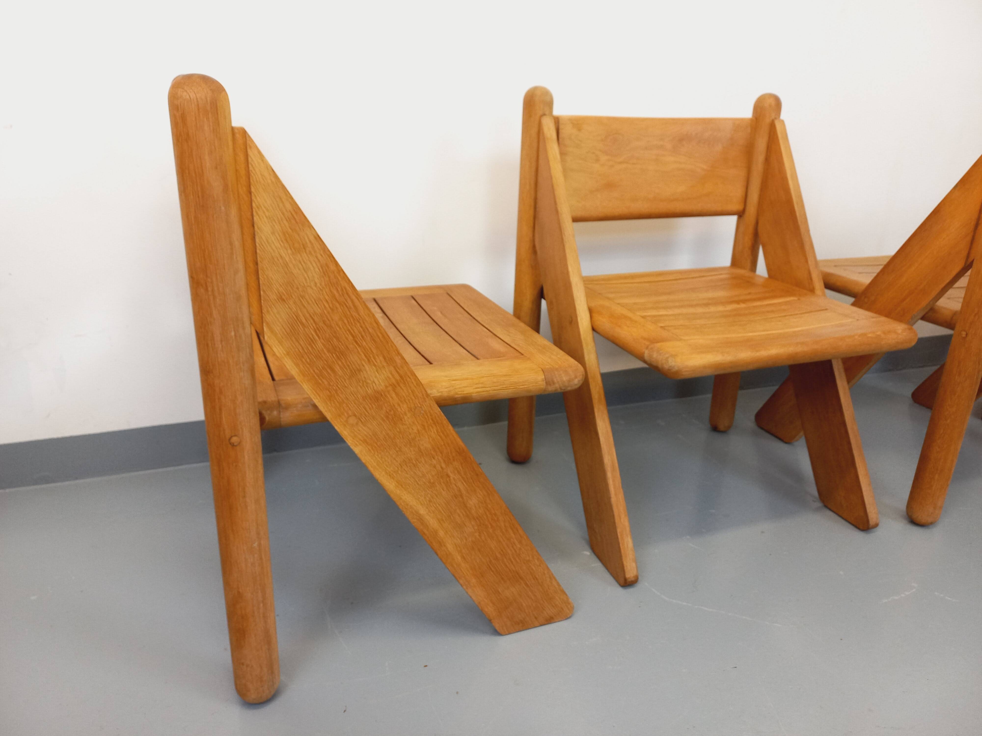 Set of 4 vintage brutalist chairs in solid oak from the 1960s.