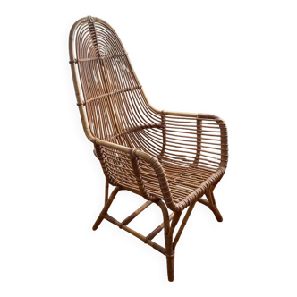 Vintage rattan armchair with high back from the 1970s.