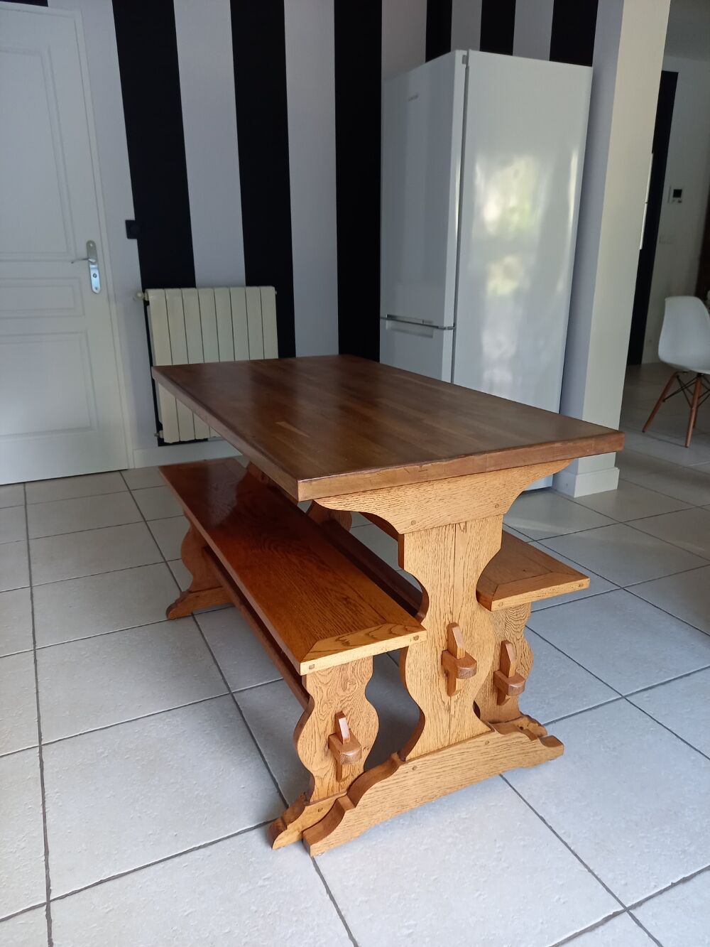 Solid oak table and its two benches made by a craftsman.