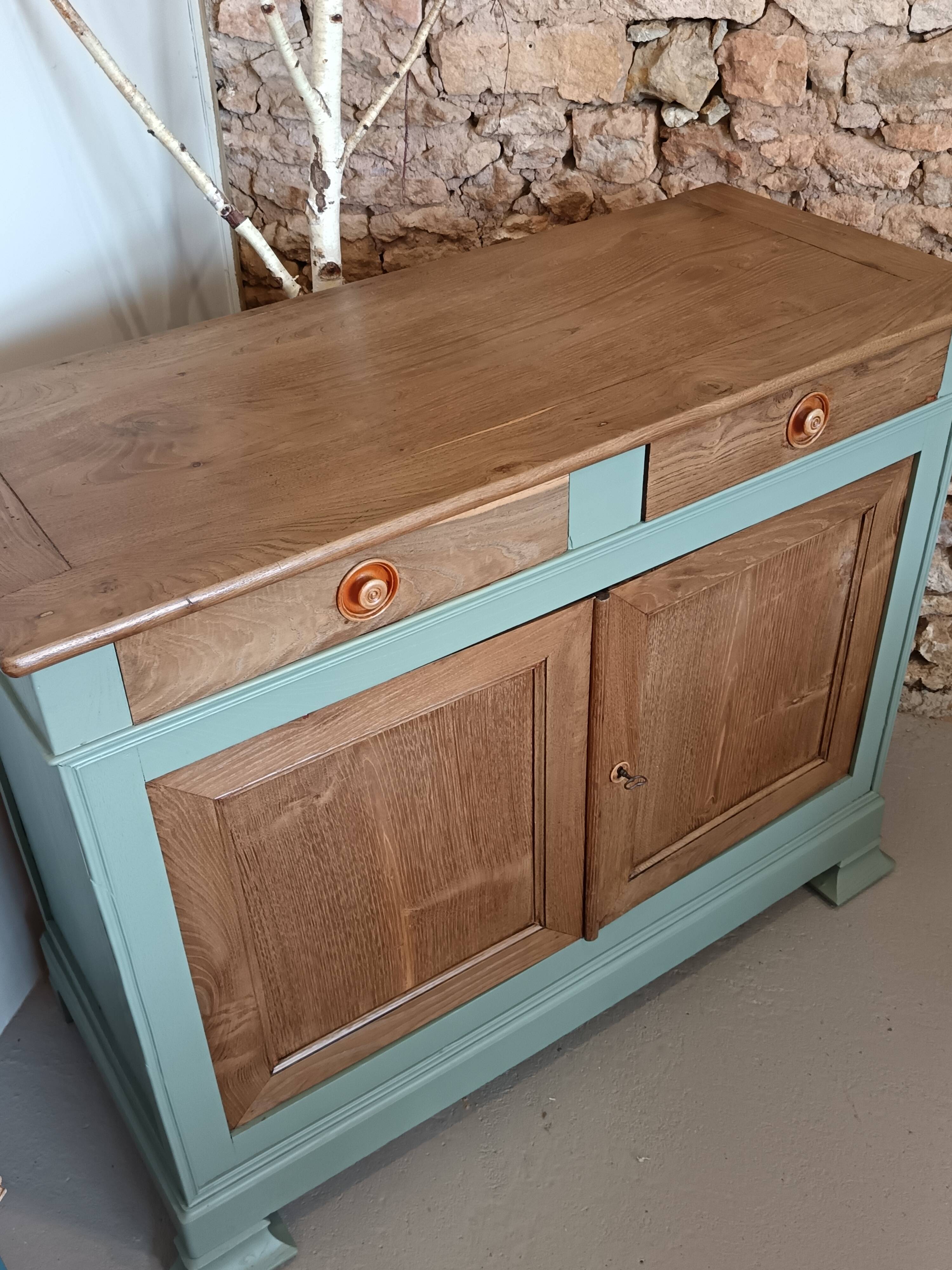 Buffet made of natural wood and bronze green.