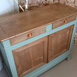 Buffet made of natural wood and bronze green.