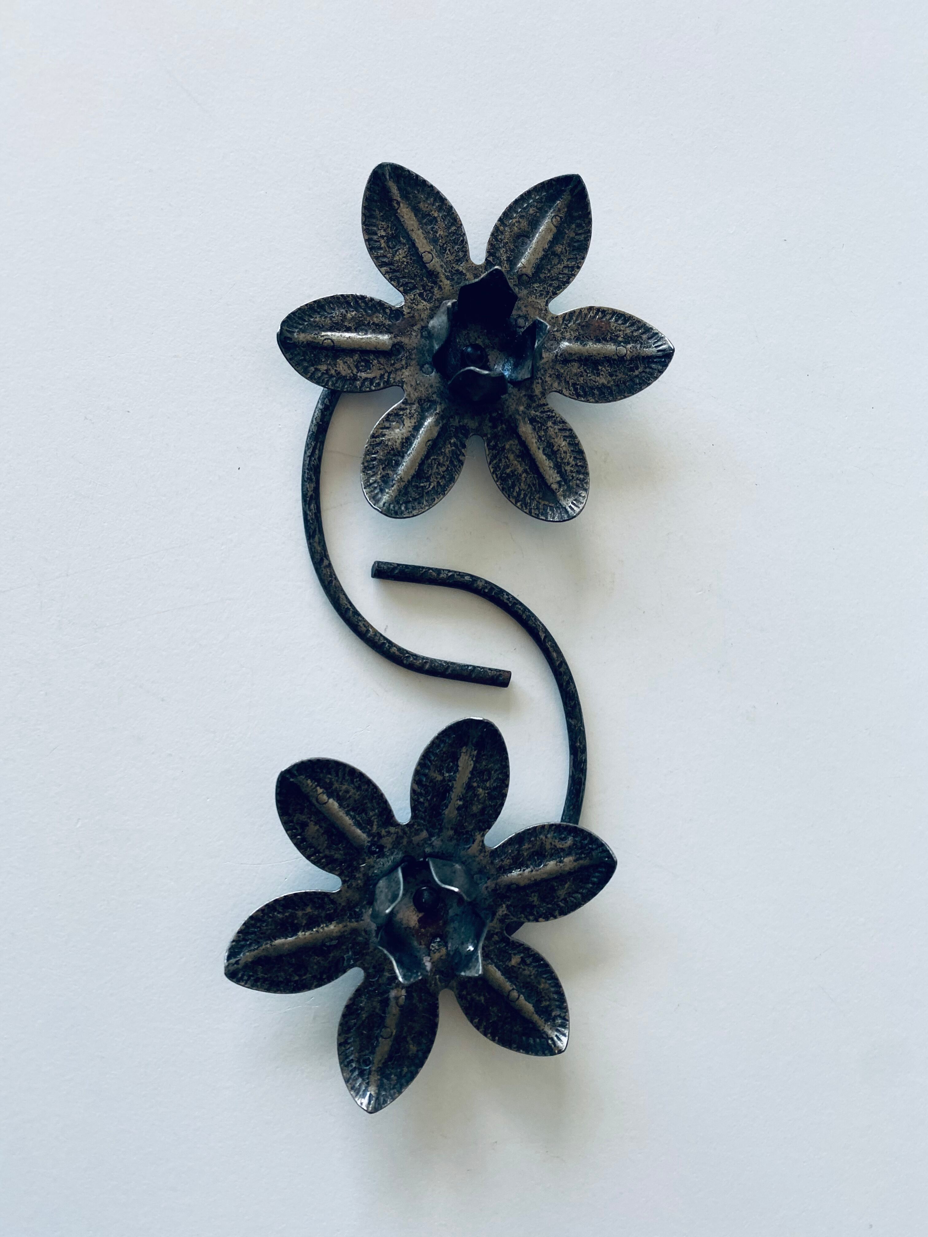 Pair of iron water lily candle holders