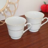 Set of 2 white porcelain cups with gold rim