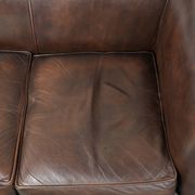 Set of a smooth chesterfield sofa and armchair with a timeless English look