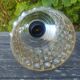 A 70s-vintage amber molded glass "bubble" pendant/lamp