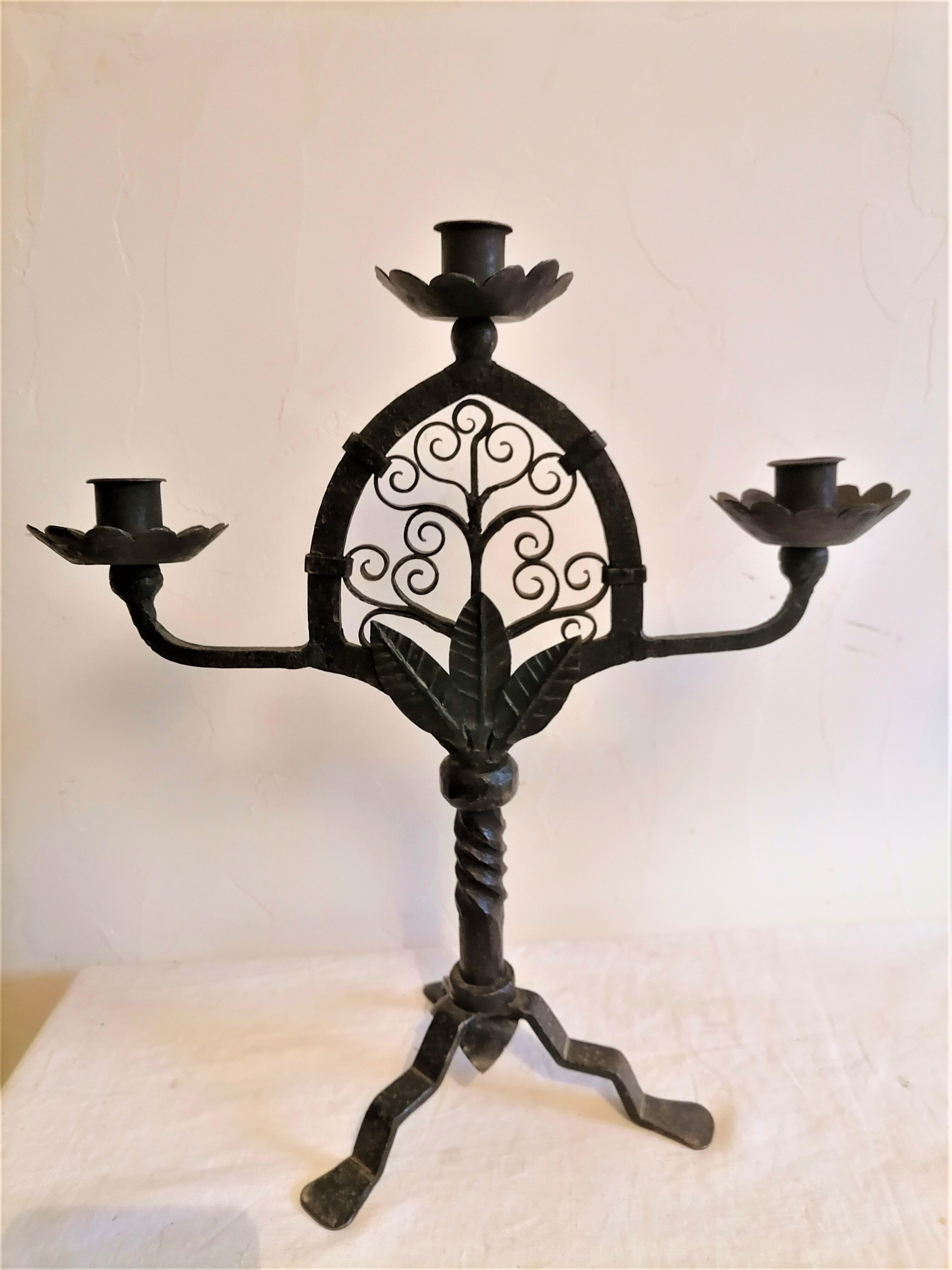 Pair of wrought iron candelabras. Mid-twentieth century.