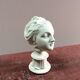 Plaster sculpture young woman with headband 1910