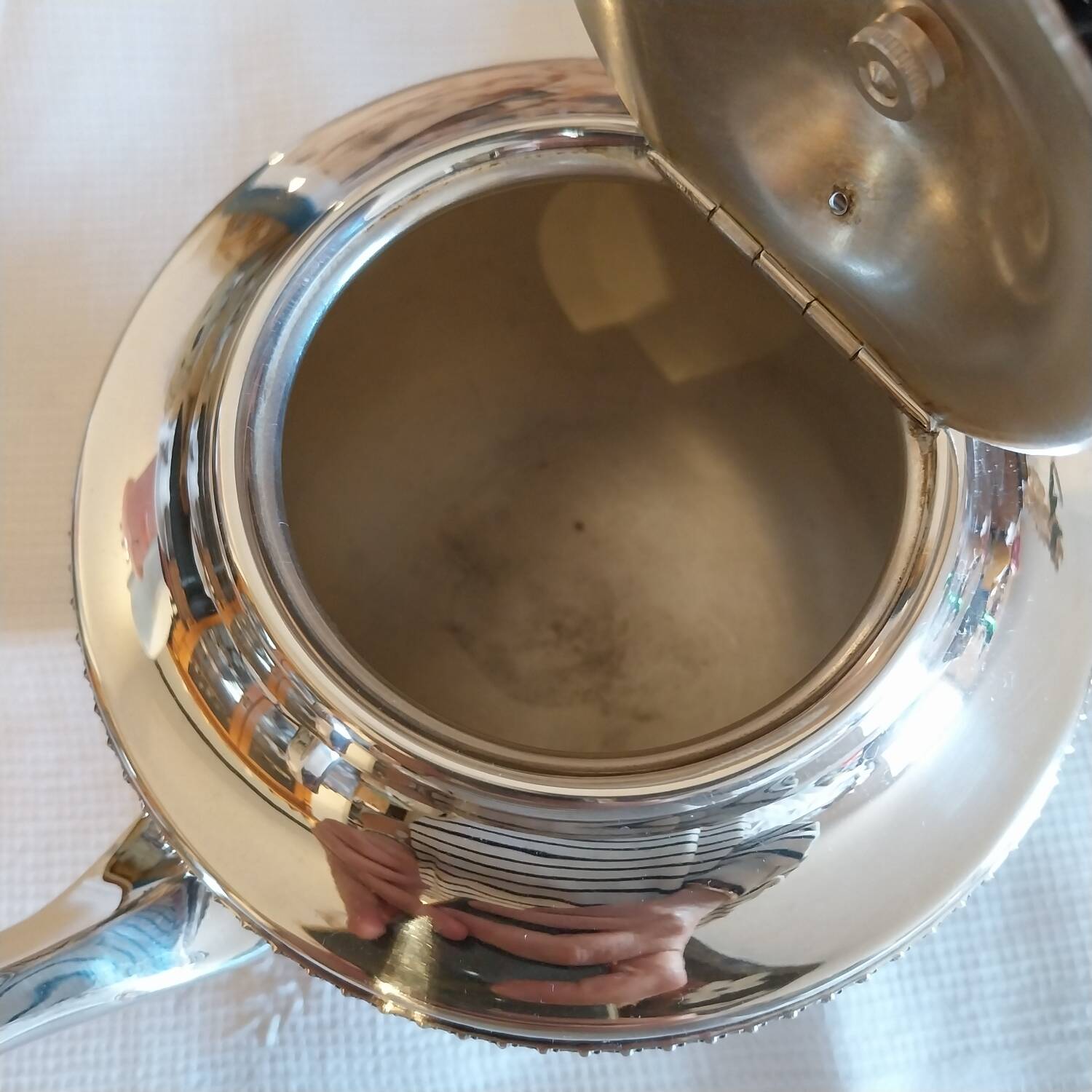 Old English teapot in silver-plated metal and Bakelite.