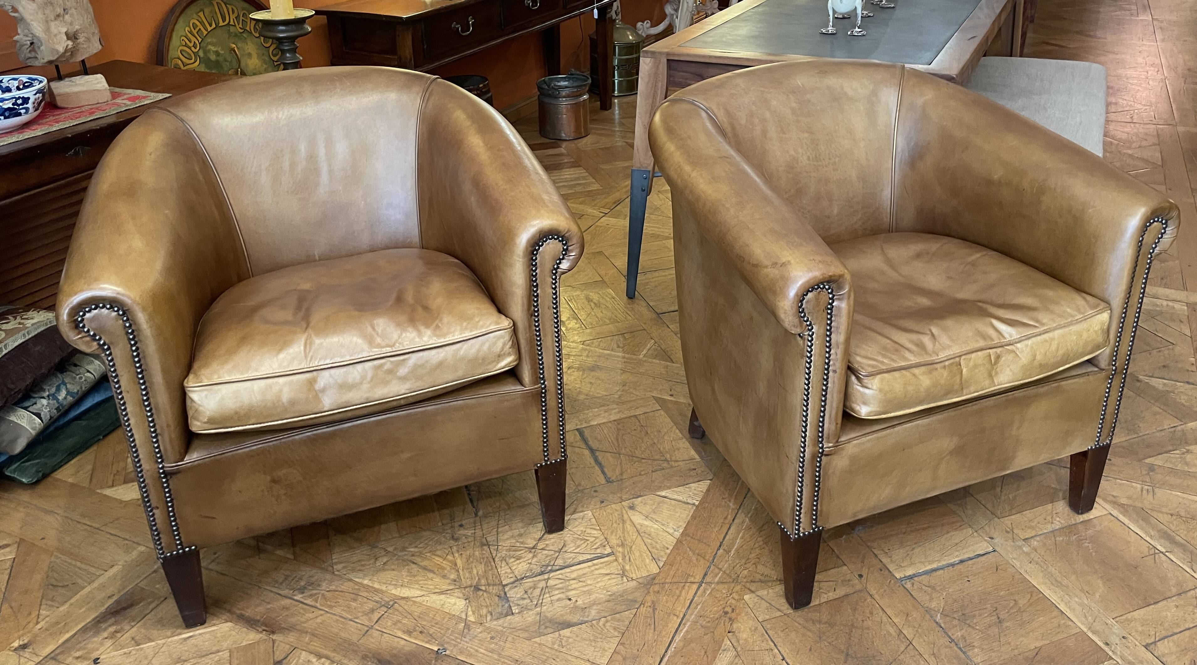 pair of camel leather club armchairs