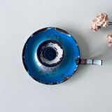 Old enamelled metal candlestick