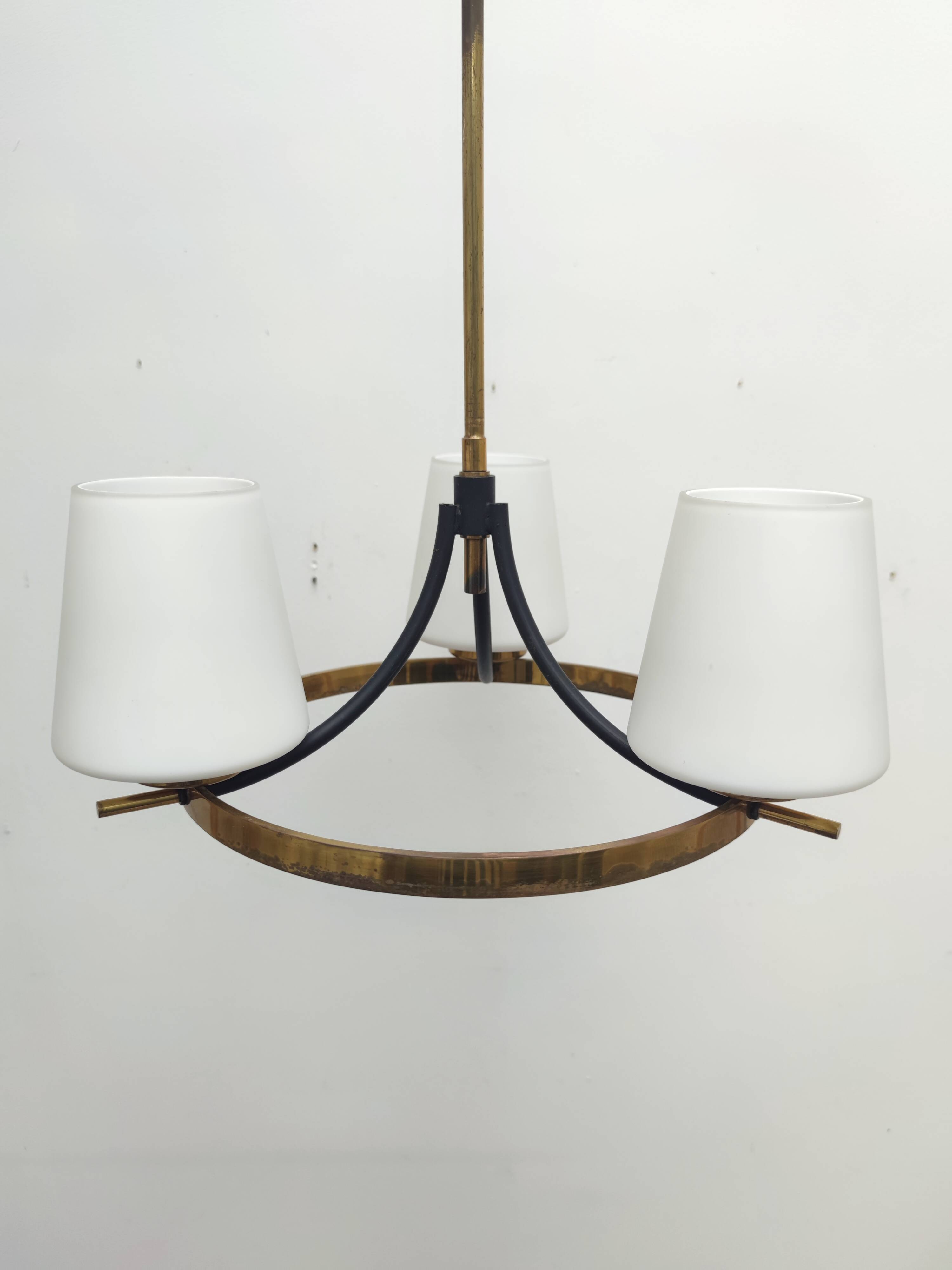 Brass chandelier and white opalines