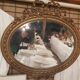 Louis XVI style oval beveled mirror