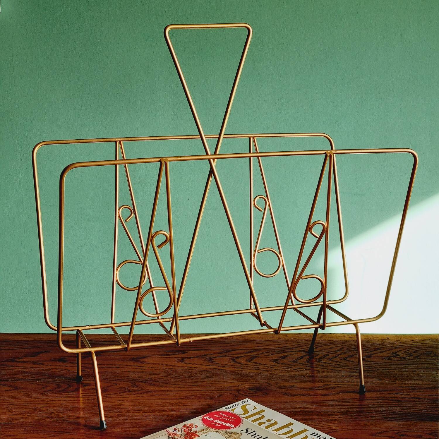 Golden metal magazine holder