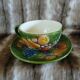 Antique cup and saucer in slipware.