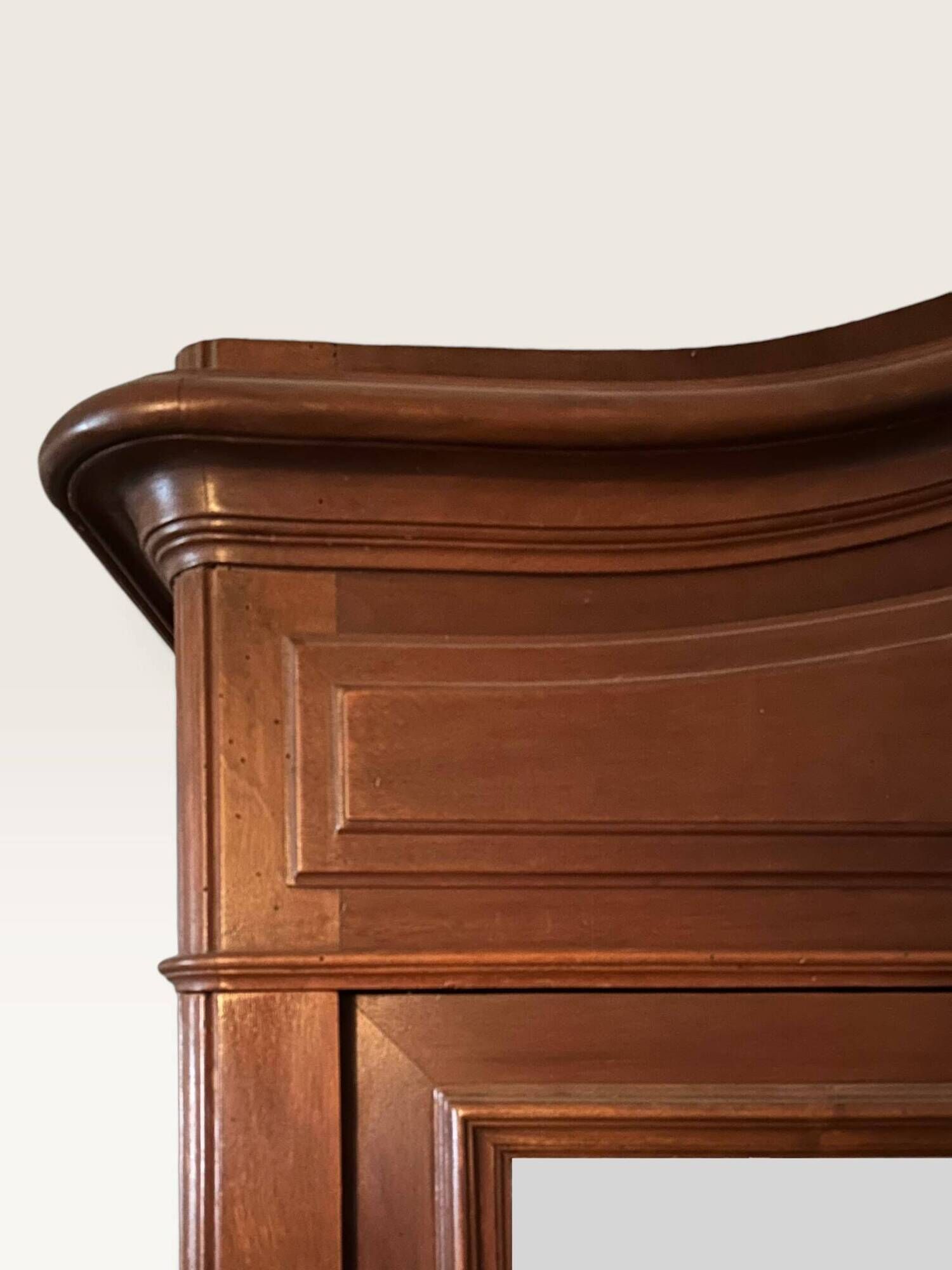 Louis XV style armoire with two bevelled mirror doors.