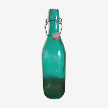 Bottle with green lemonade