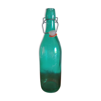 Bottle with green lemonade