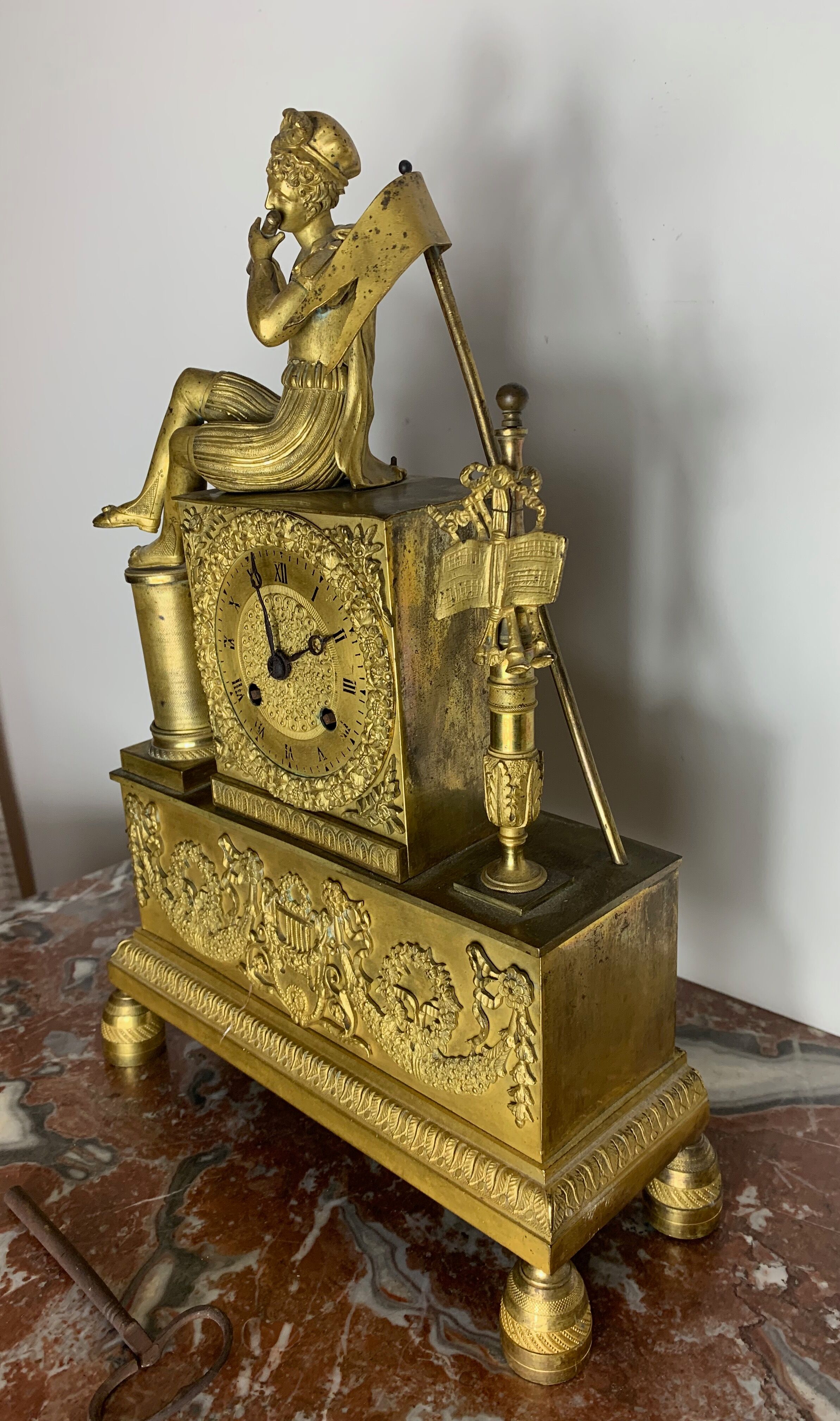 Period clock restoration in gilded bronze