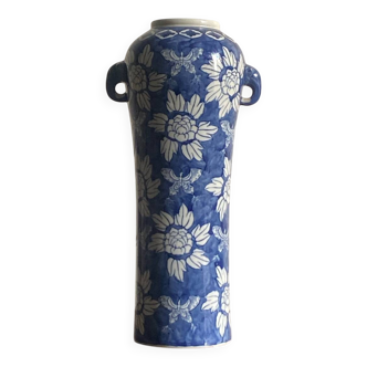 Blue vase with flower decoration