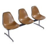 Tandem bench with brown Naugahyde pad shell chairs by Charles and Ray Eames for Herman Miller