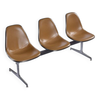 Tandem bench with brown Naugahyde pad shell chairs by Charles and Ray Eames for Herman Miller
