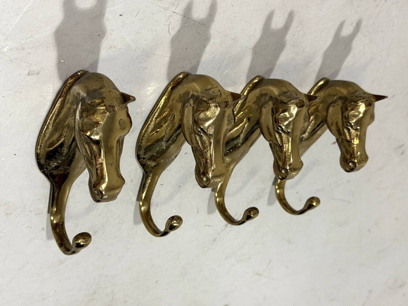 Brass horses coat hooks 1960’s, set of 4