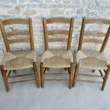 Trio of wooden chairs and mulched seat