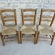 Trio of wooden chairs and mulched seat