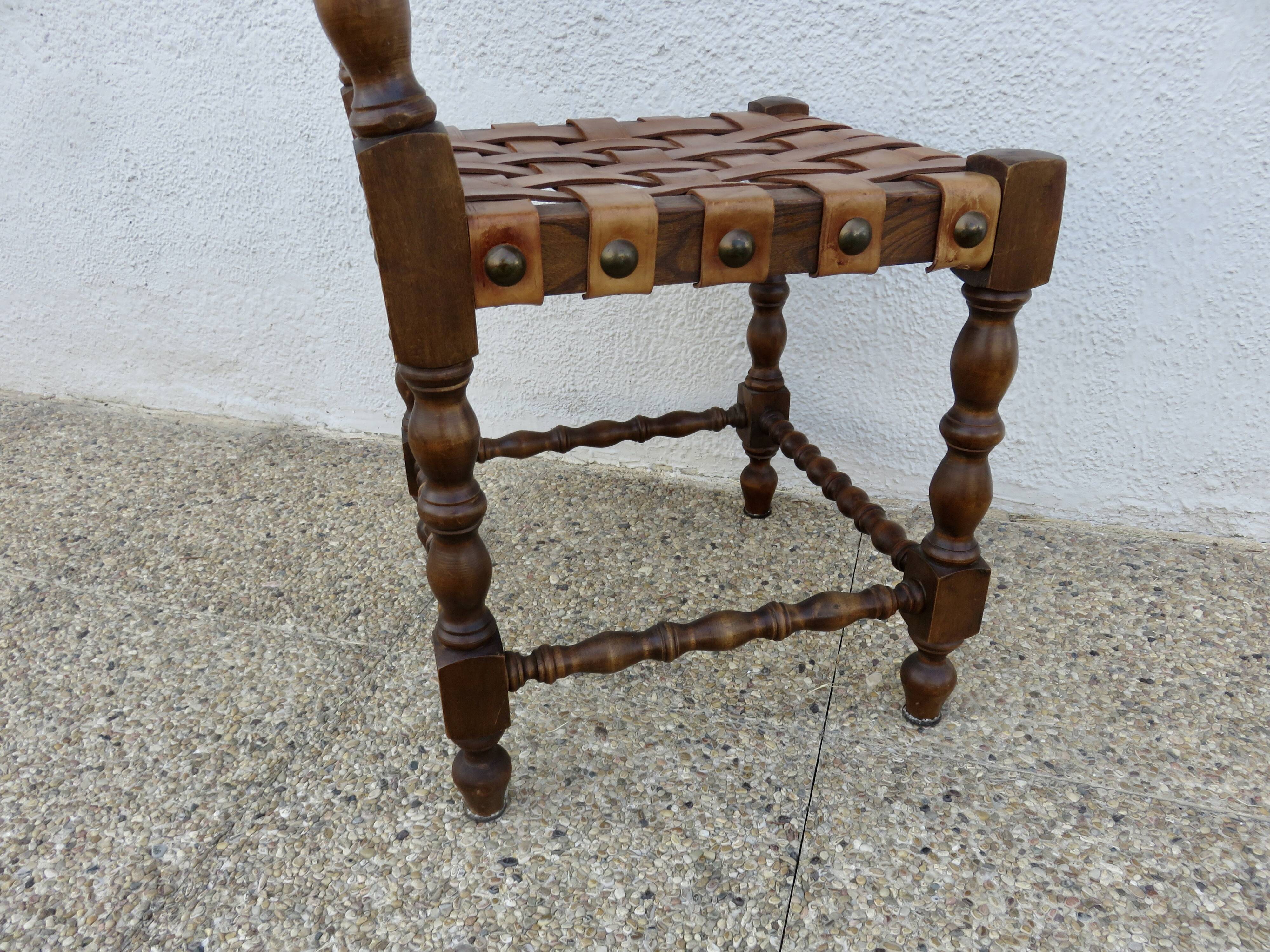 Spanish chair in oak with thick cognac leather straps, 1940s.