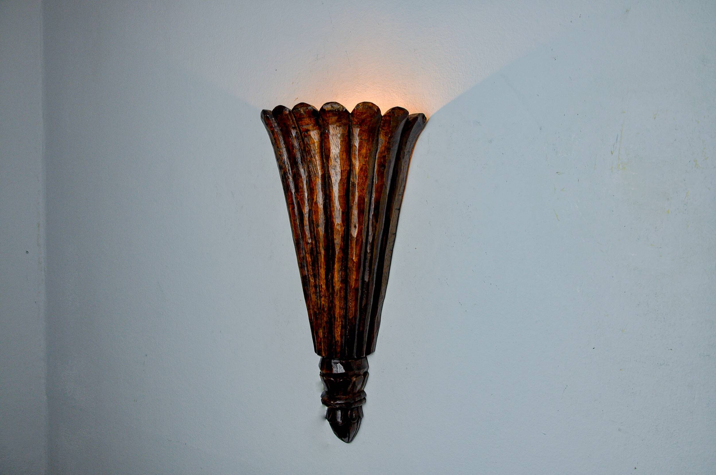 Art Deco wall light in carved wood, France, 1930