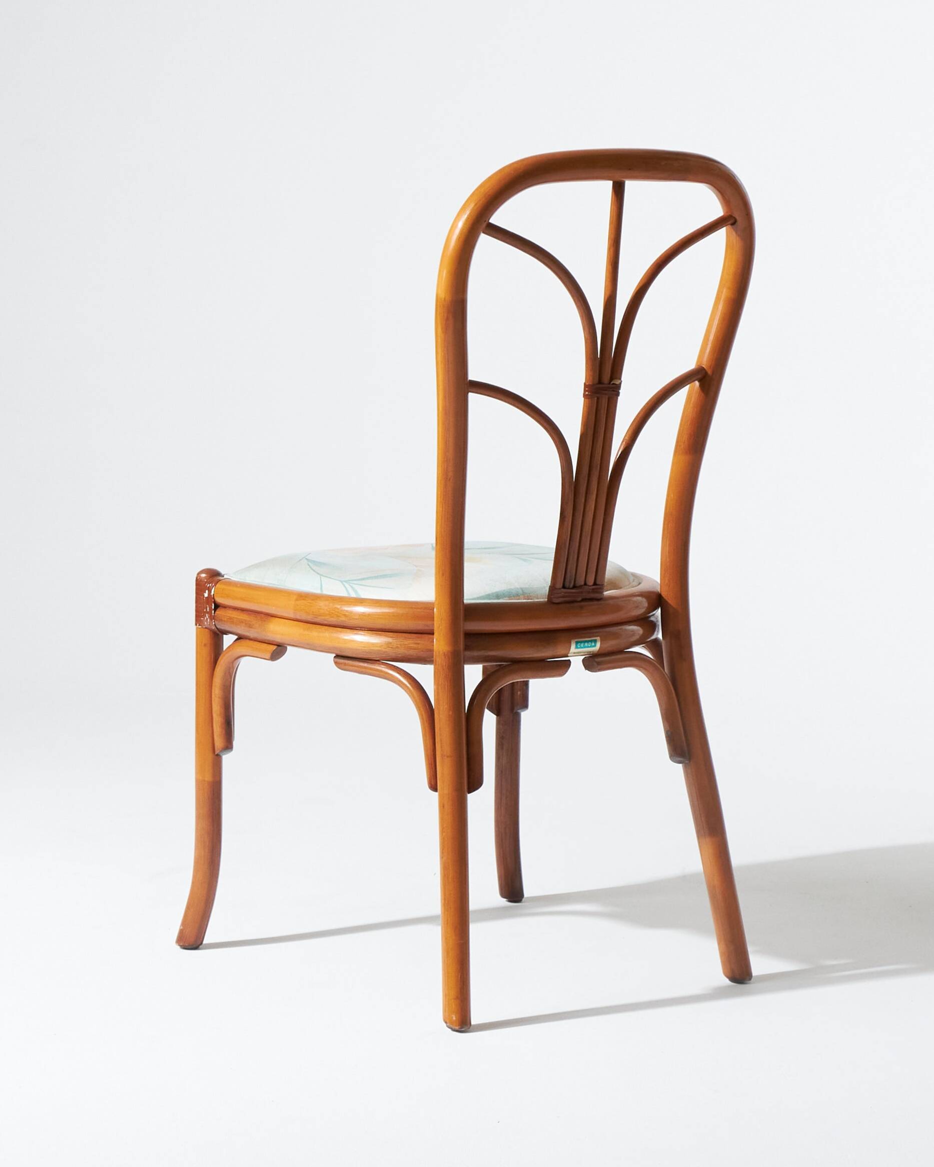 Pair of rattan and blue floral fabric chairs
