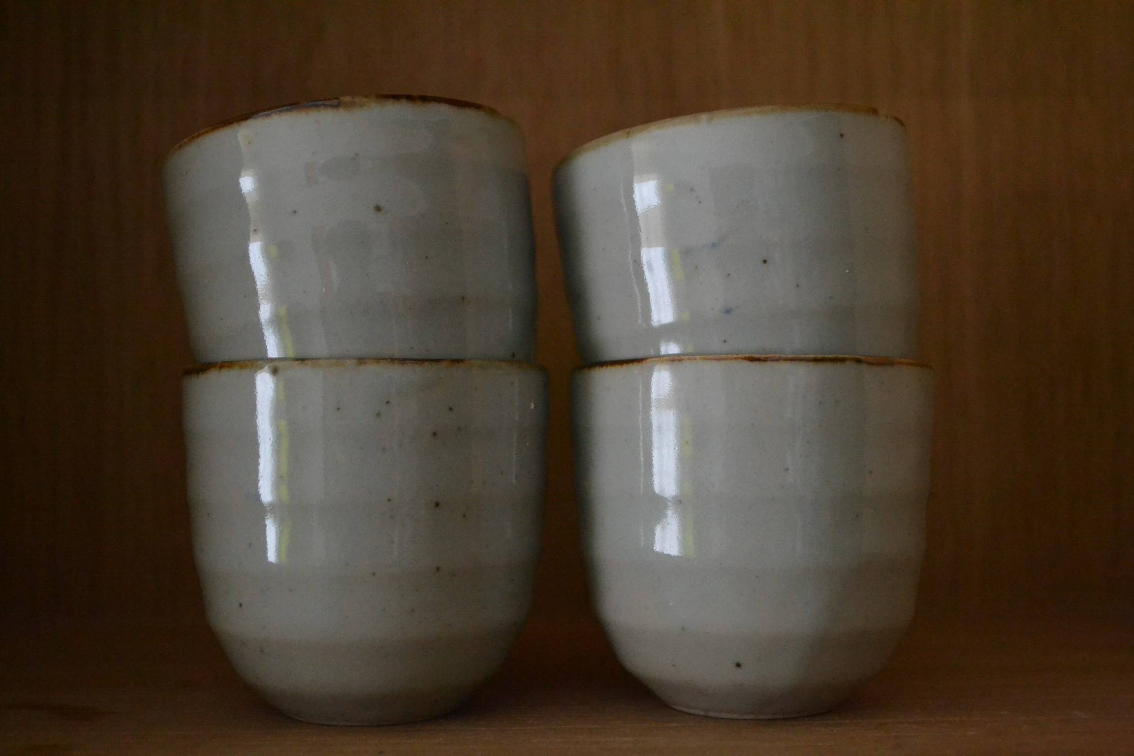 Set of 4 small stoneware tea bowls.