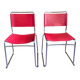 2 tubular chairs in red leather 1970