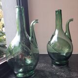 Pair of blown glass wine decanters in blue/green hues.