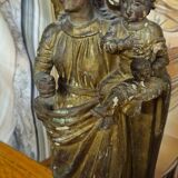 Ancient statue of the Virgin and Child in polychrome and gilded carved wood.