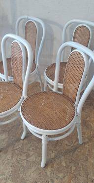 4 white rattan and cane chairs