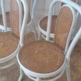 4 white rattan and cane chairs