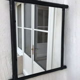 Black lacquered rattan mirror